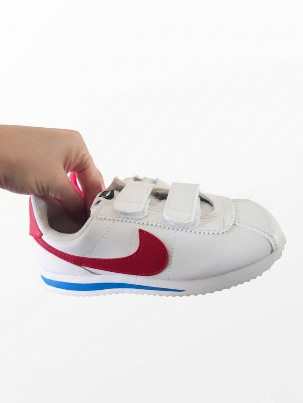 Nike Kids White Sneakers with Red Swoosh and Blue Accent